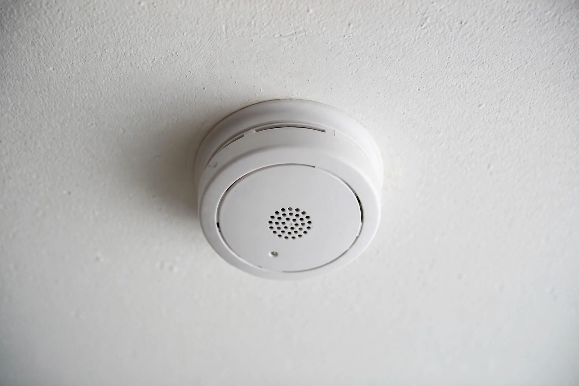 Smoke detector installed on a home ceiling